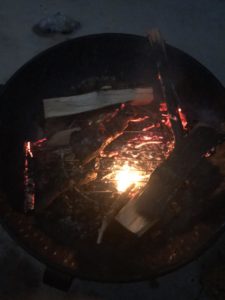 A campfire dies out when the logs are rolled to the sides instead of pushed together.